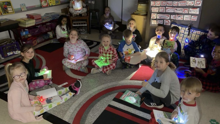 first grade reading with flashlights