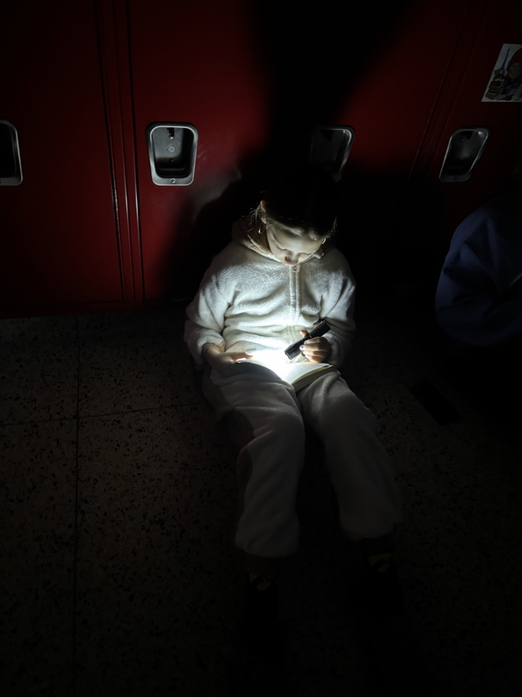 flashlight readers in the hallway