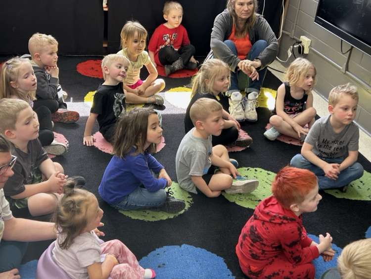 kindergarten students explore stations