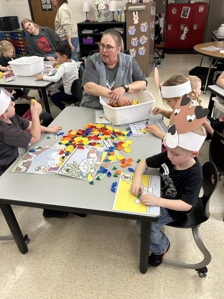 kindergarten students explore stations