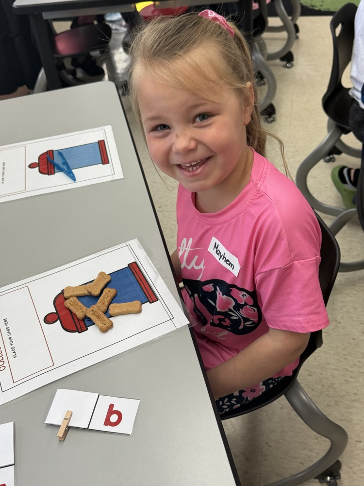 kindergarten students explore stations