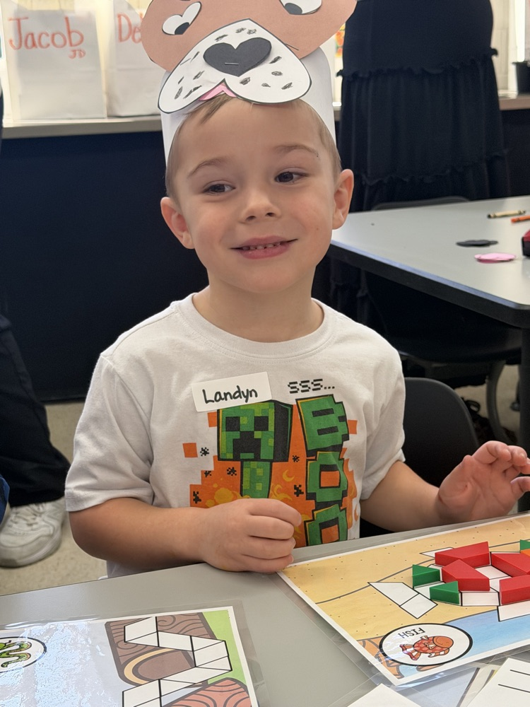 kindergarten students explore stations