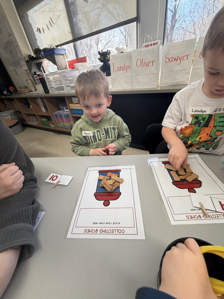 kindergarten students explore stations
