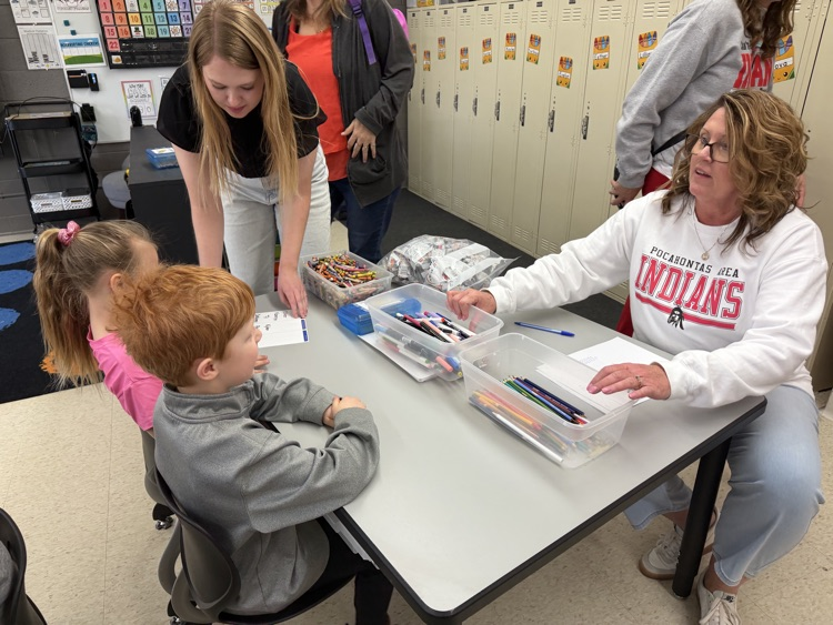 kindergarten students explore stations