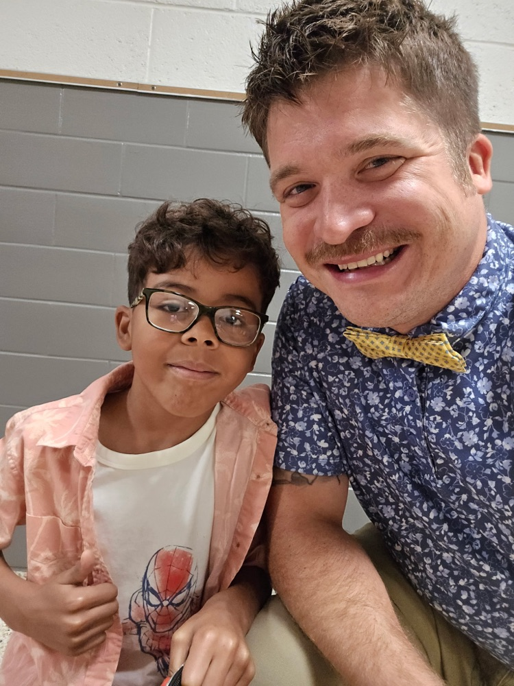 student and teacher posing for dress up day 