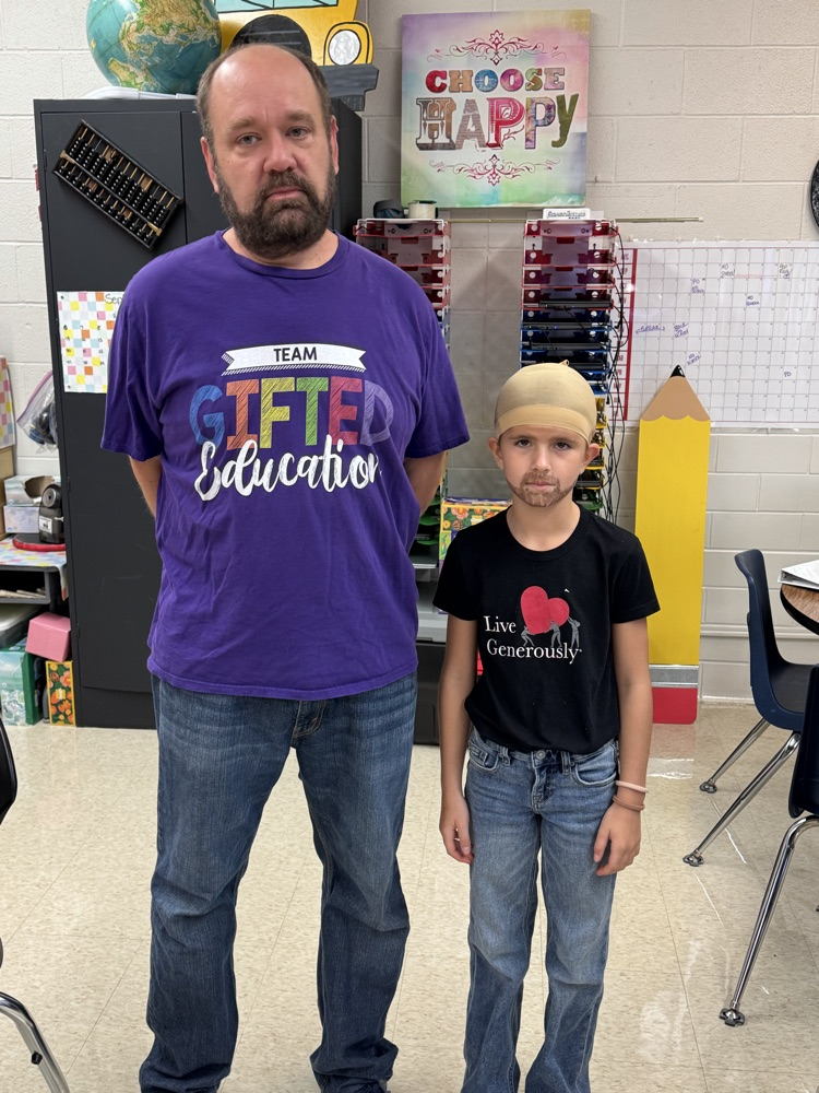 student and teacher posing for dress up day 