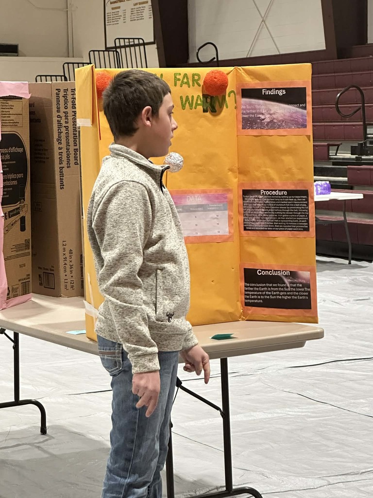 students presenting at science fair