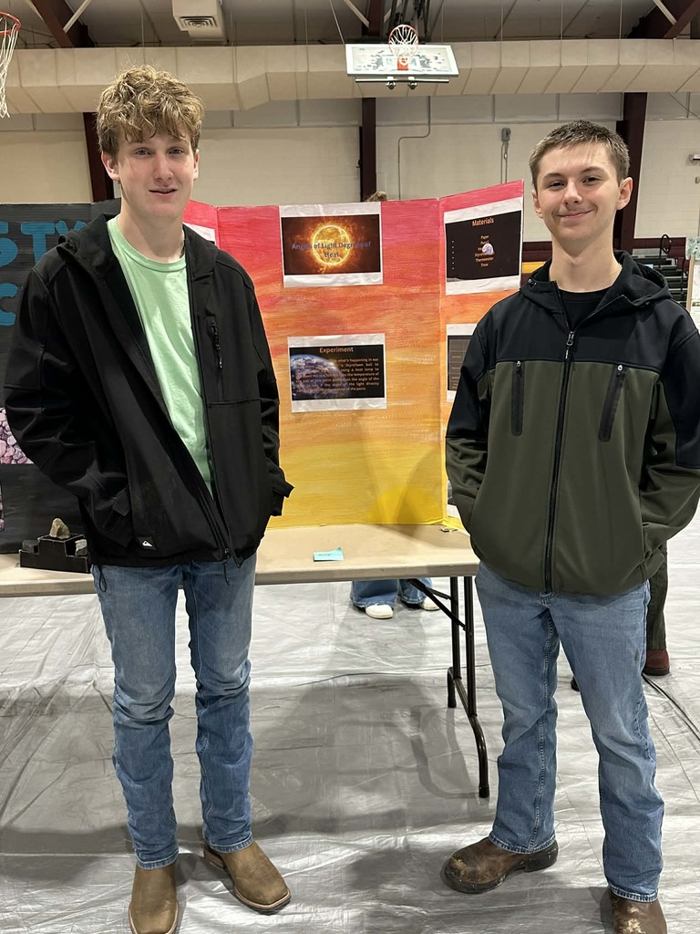 students presenting at science fair