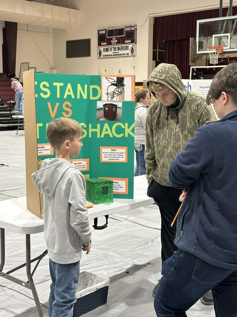 students presenting at science fair