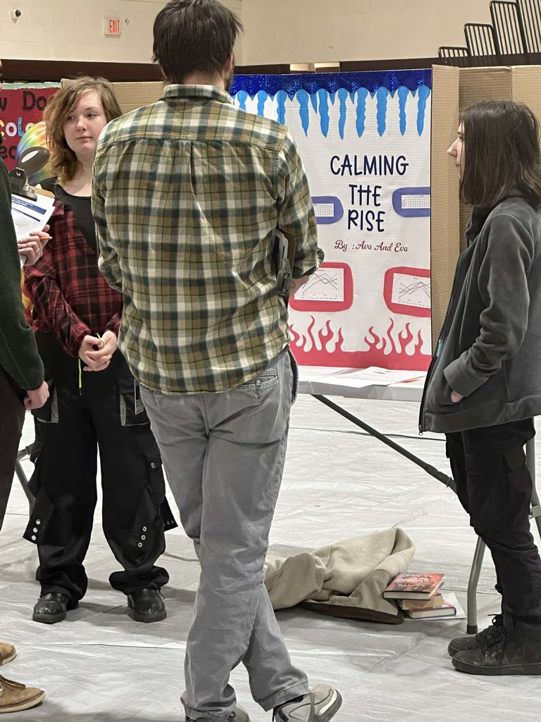 students presenting at science fair