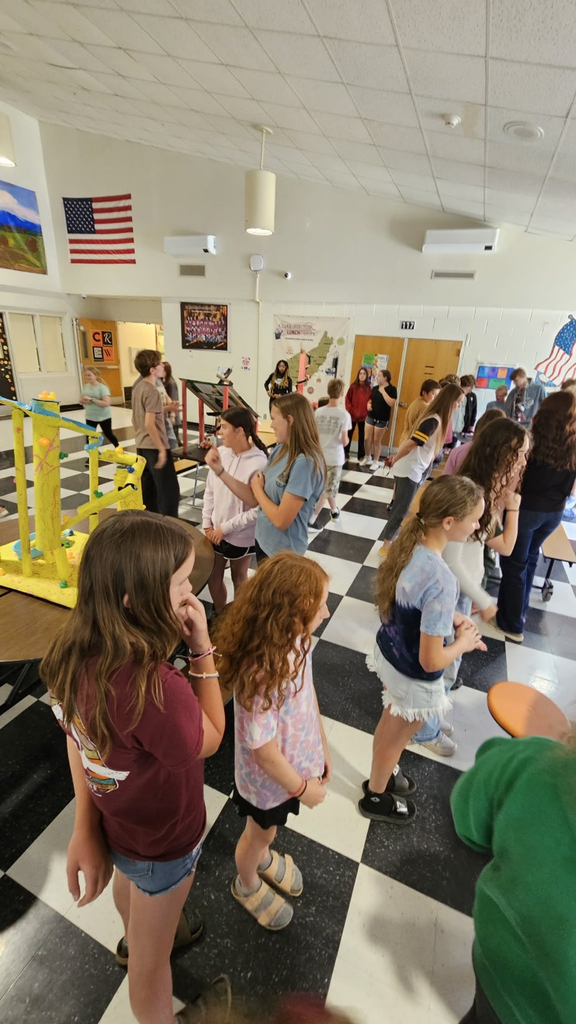 group of mms students looking at a roller coaster 