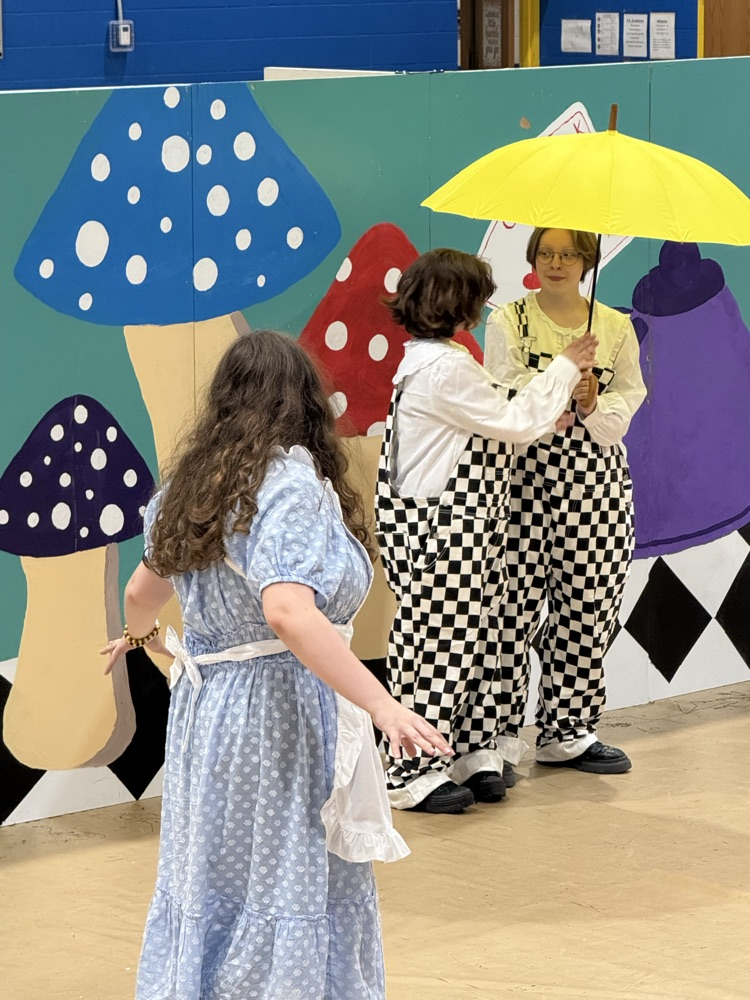 images of students performing Alice in Wonderland