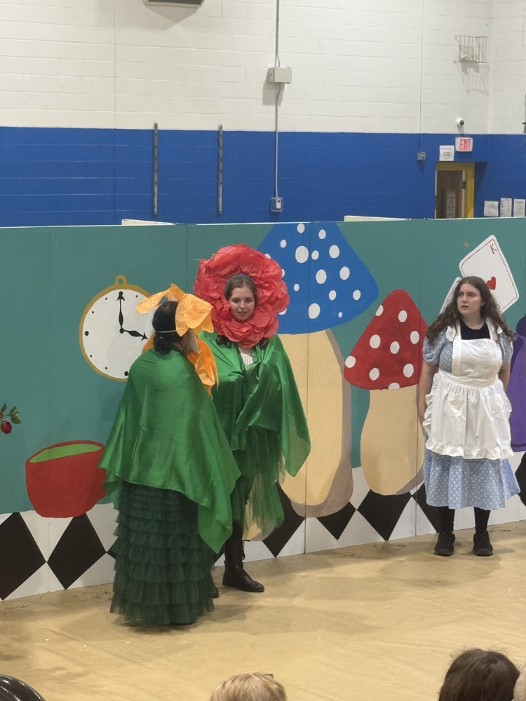 images of students performing Alice in Wonderland