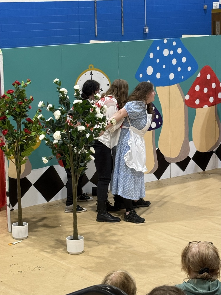 images of students performing Alice in Wonderland