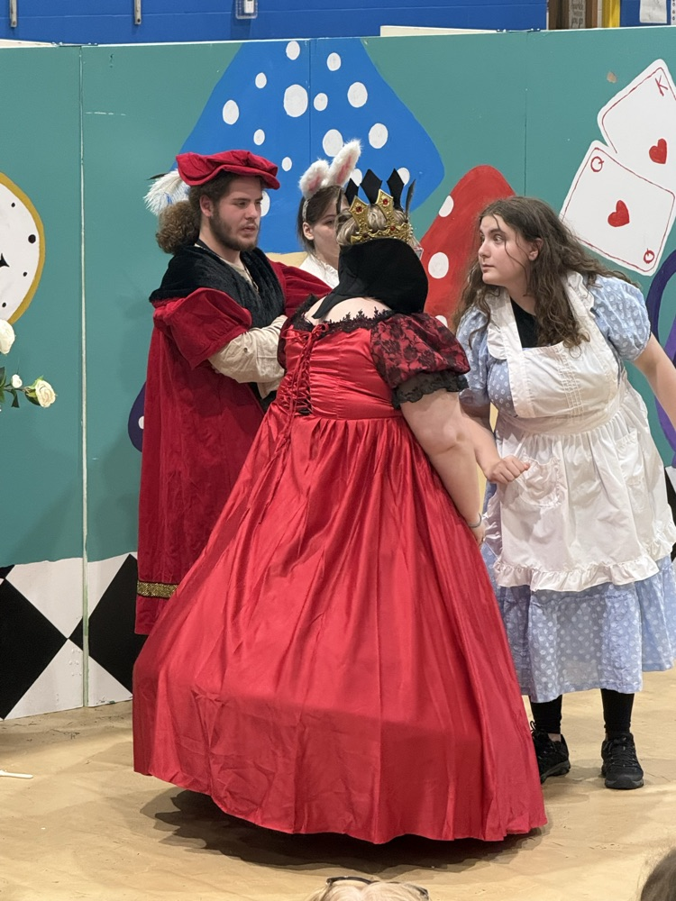 images of students performing Alice in Wonderland