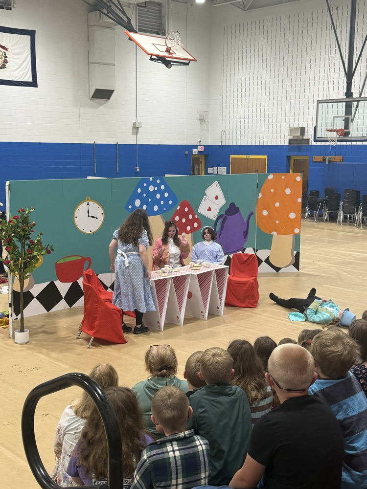 images of students performing Alice in Wonderland
