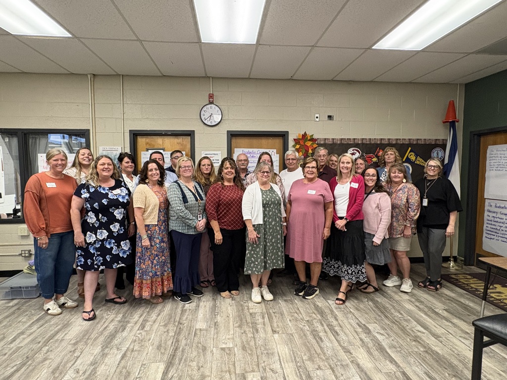 group photo of stakeholders at meeting
