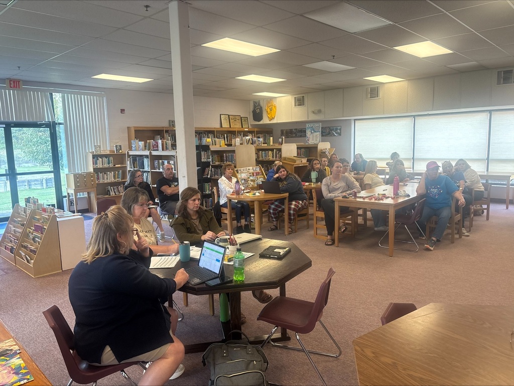 staff at table participating in professional learning