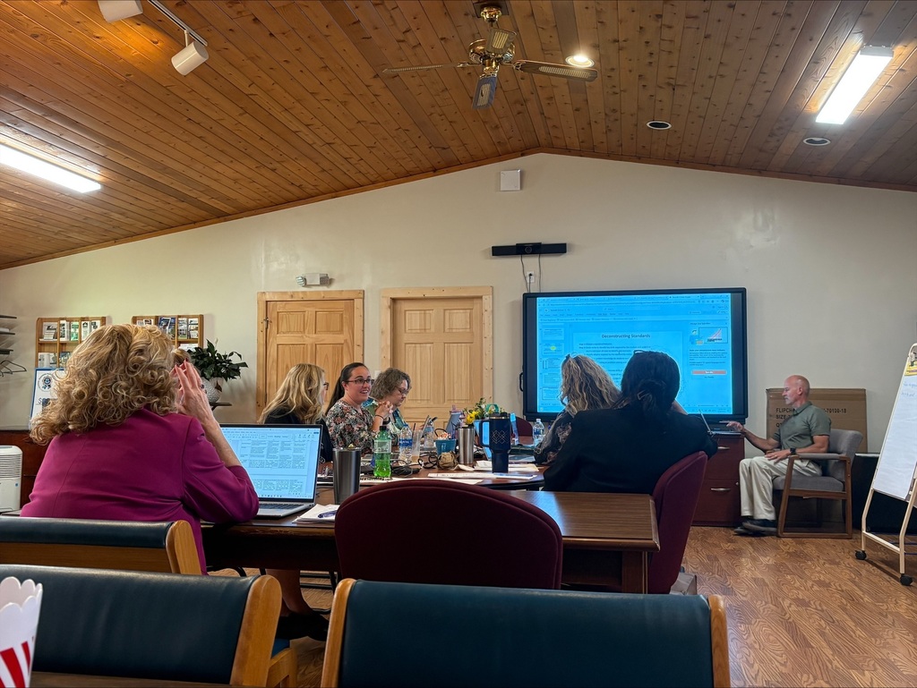 staff at table participating in professional learning