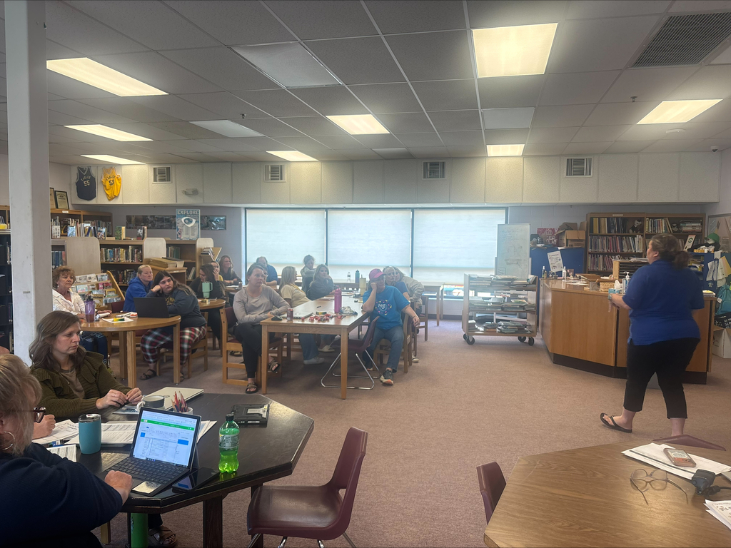 staff at table participating in professional learning