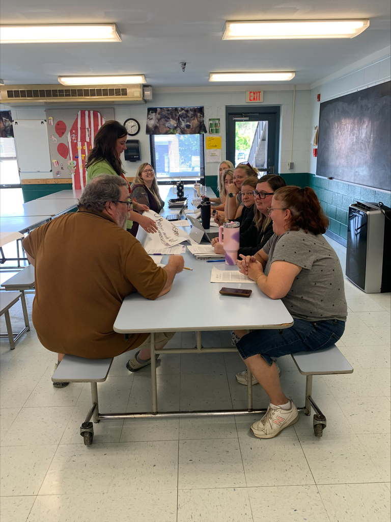 staff at table participating in professional learning