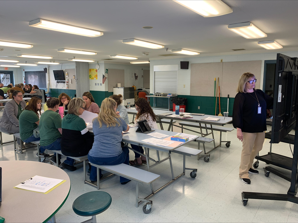 staff at table participating in professional learning