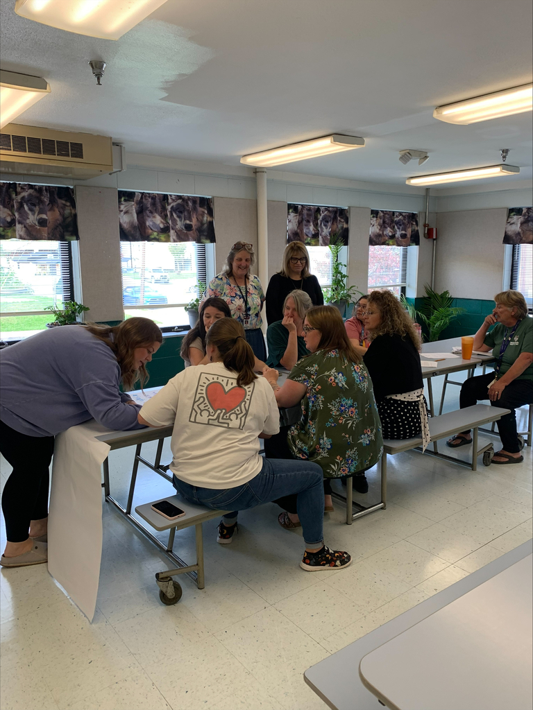 staff at table participating in professional learning