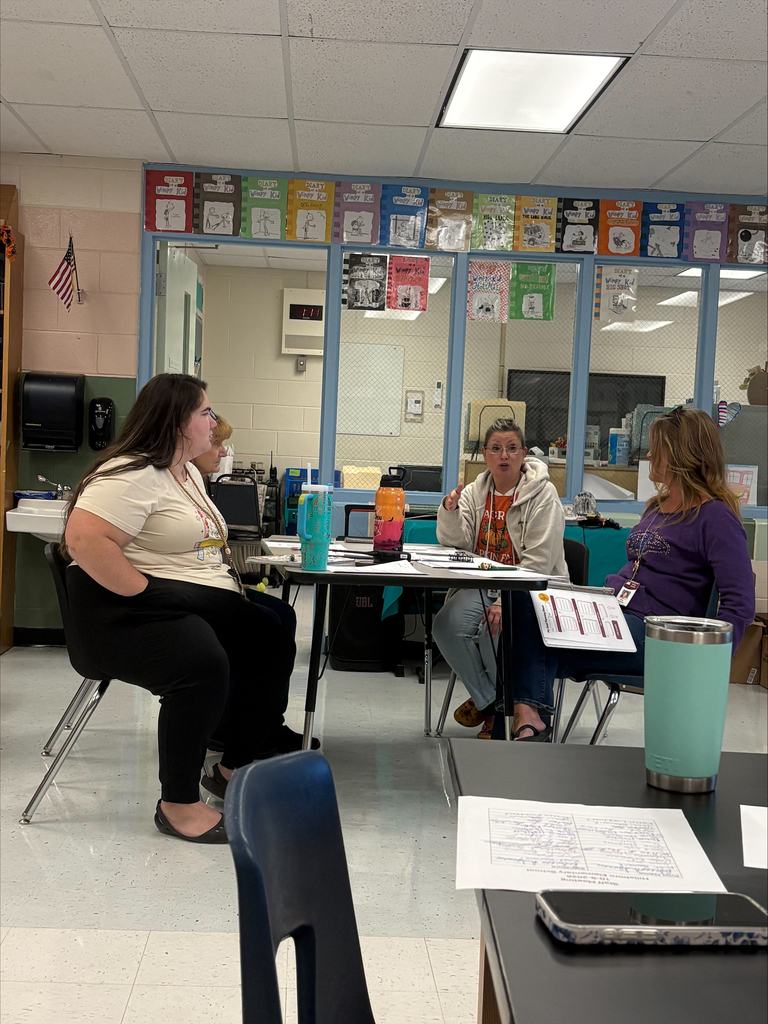 staff at table participating in professional learning