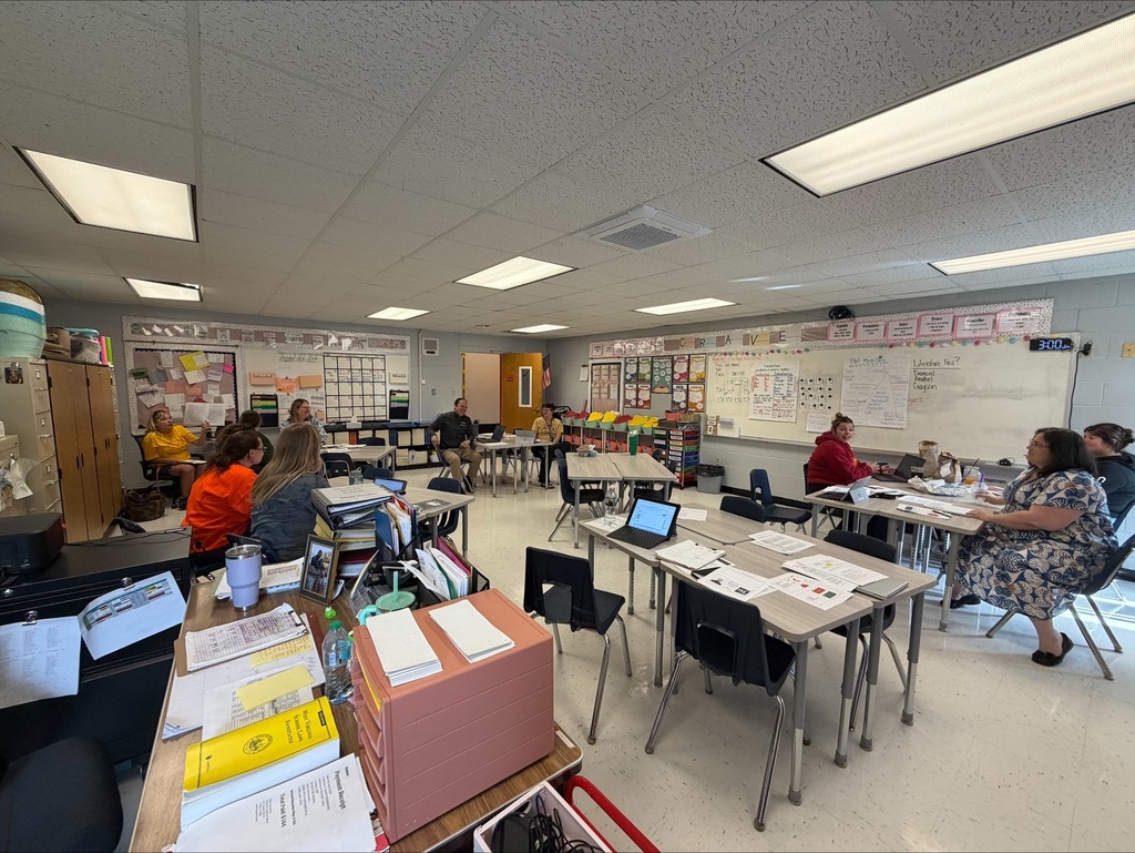 staff at table participating in professional learning