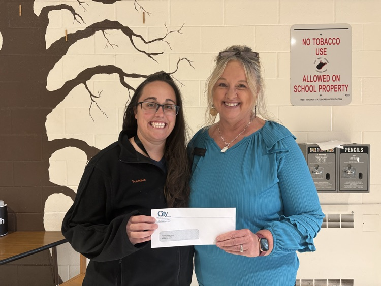 Mrs. Scotchie and Debbie workman with check for mms from partner in education 