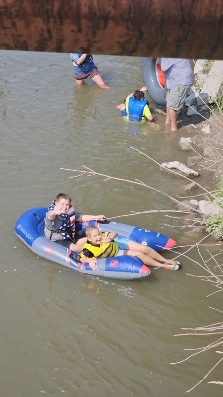 waving from the river