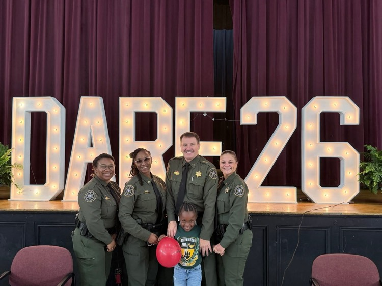 student with officers