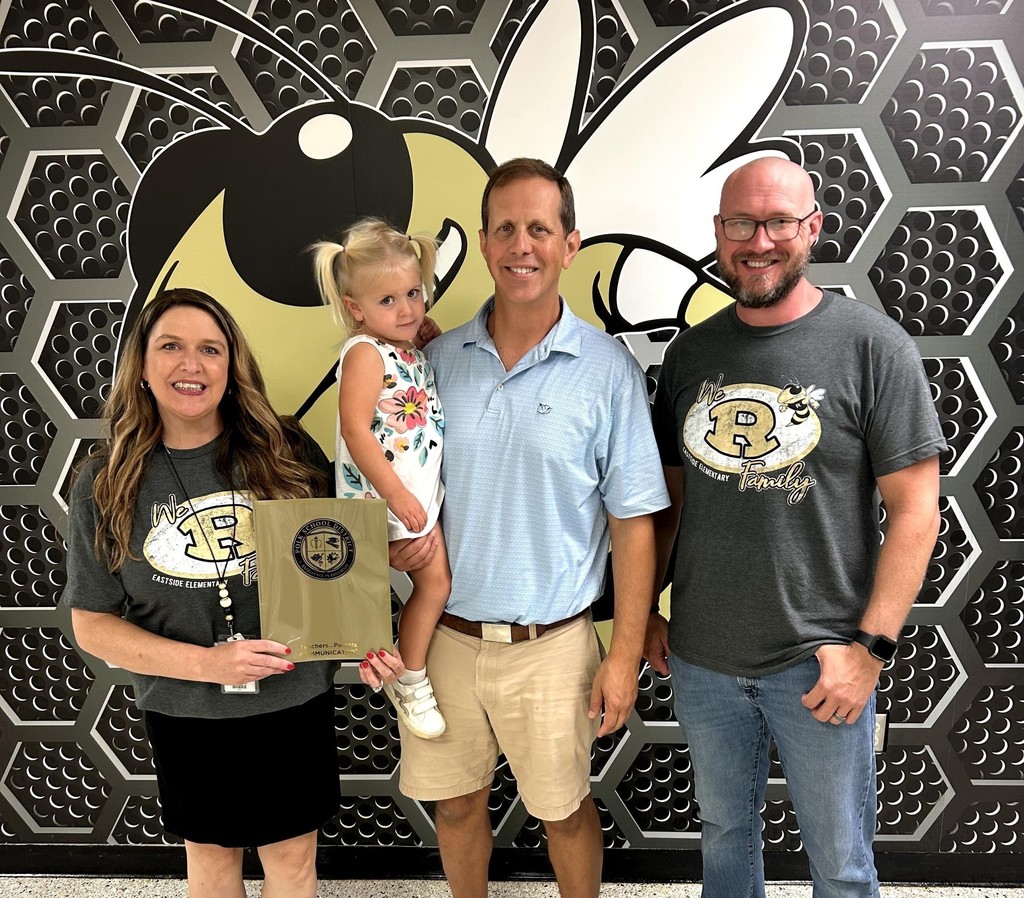 Bennett Othodontics poses with EES administrators after donating parent communicator folders.