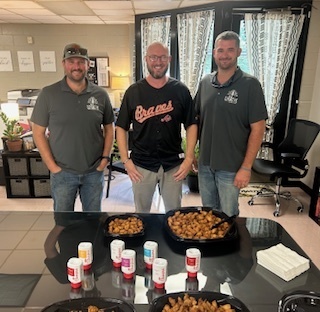 Smith Tree Service with Principal of Eastside. Chick-fil-a nuggets on the table in front.