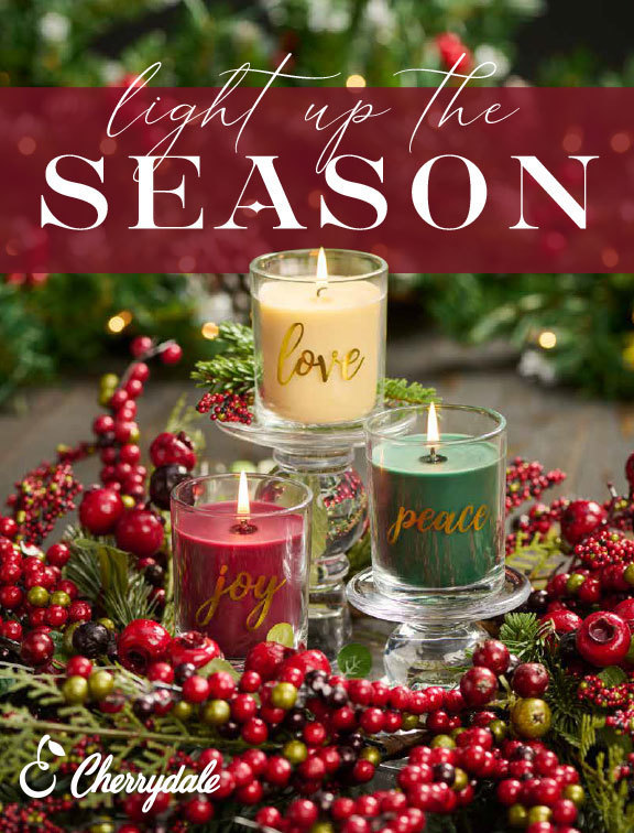 Light up the season catalog featuring Christmas candles and cranberry wreath.