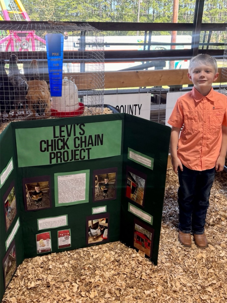 pic of Levi at the fair with his project 