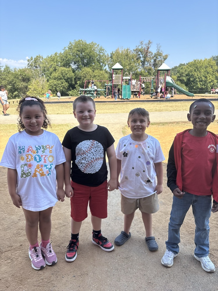 kids wearing dots for dot day 