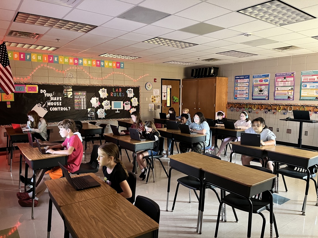 Students working on computers in computer lab. 