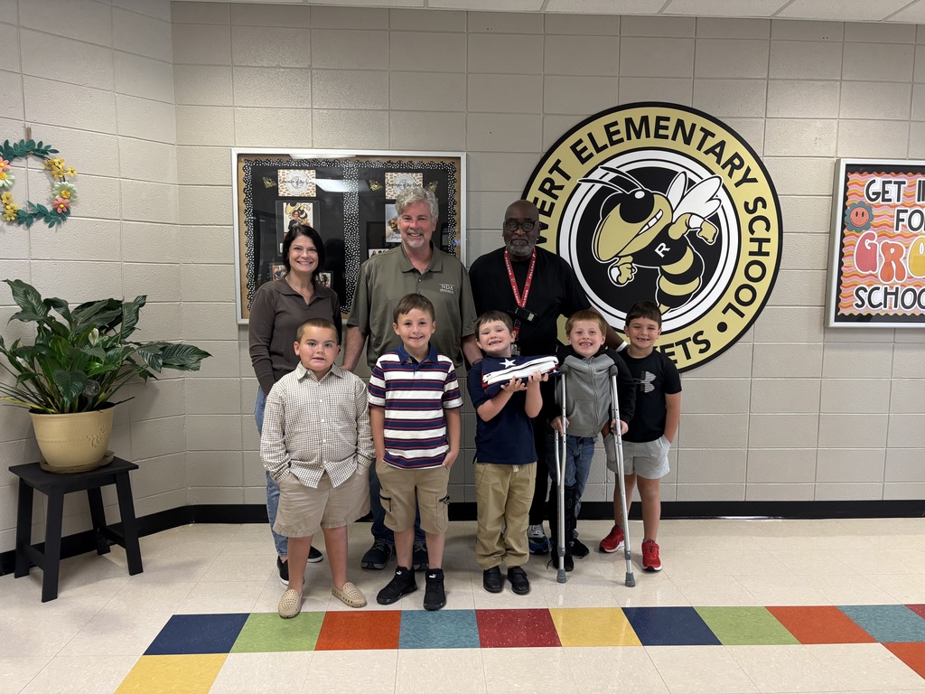 Thank you to Mr. Allen Dean from Nathan Dean Insurance for donating these wonderful flags to our school.  Mr. Dean posing in the photo with the flags and Van Wert students and Mr. Z.