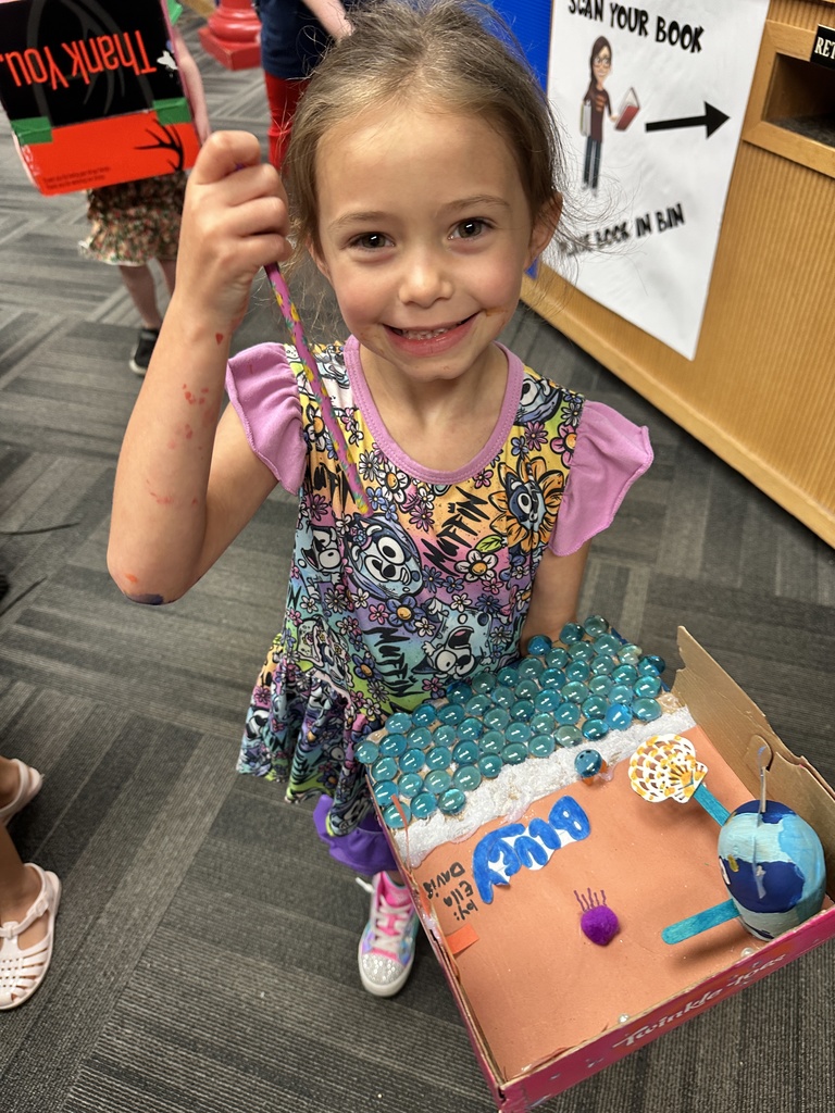 Ella posing with her potato book character.