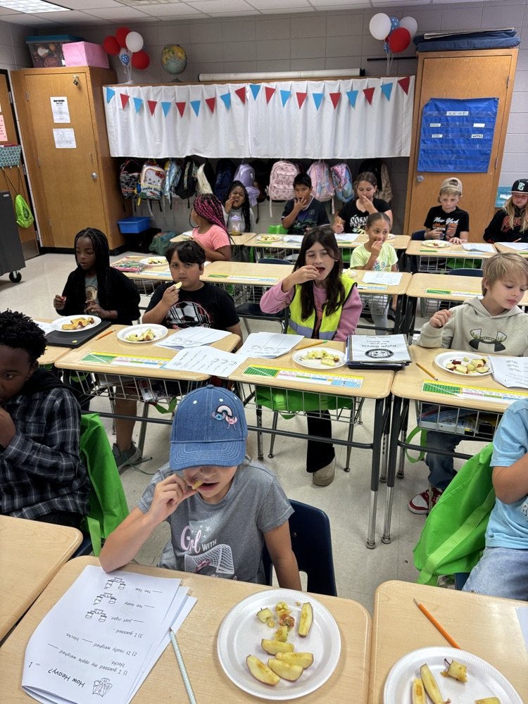 pictures of students completing Johnny Appleseed activities with Mrs. Kersey and Mrs. Masters class. 