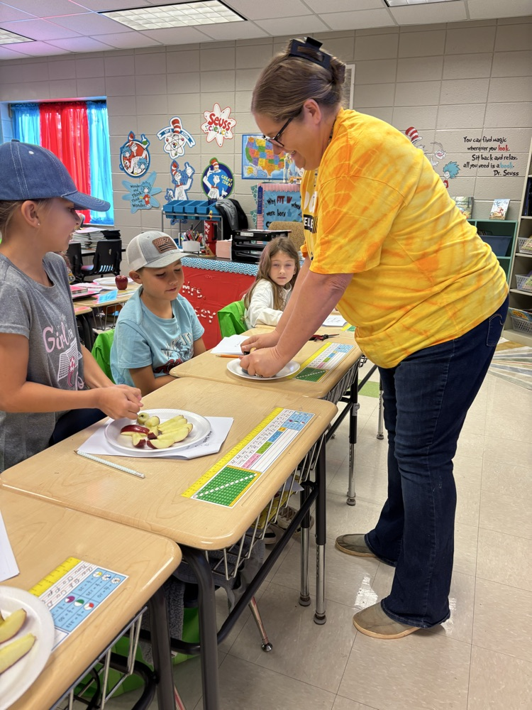 pictures of students completing Johnny Appleseed Mrs. Kersey in the pic also