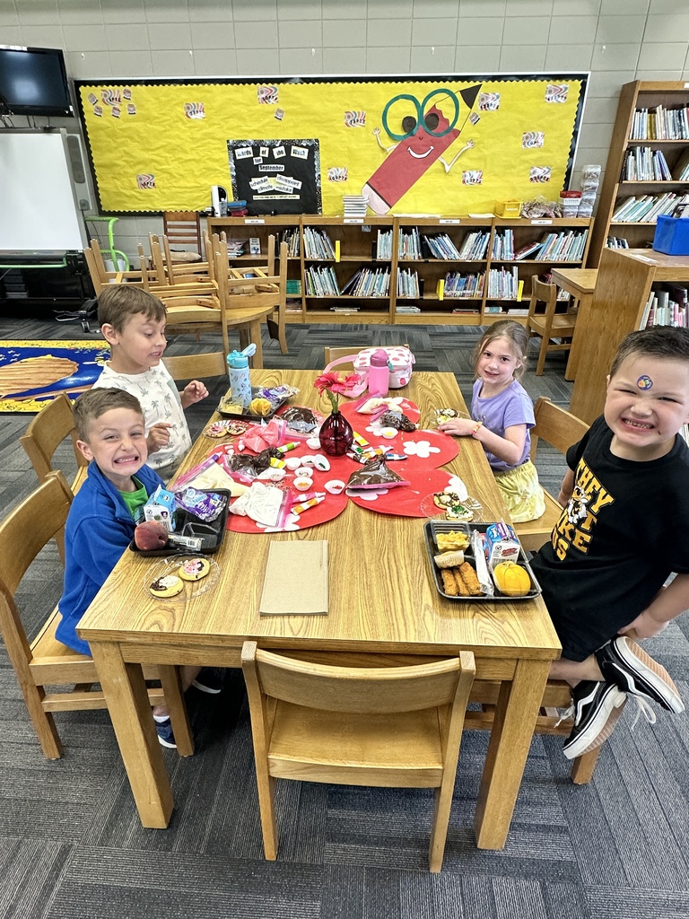 Our 1st grade winners of the september AR challenge decorating their cookies and smiling for the picture.