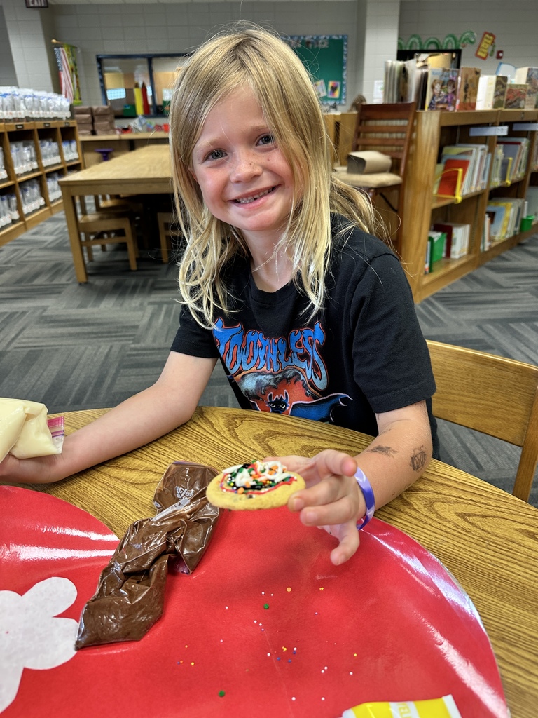Emilee decorating her cookie. 