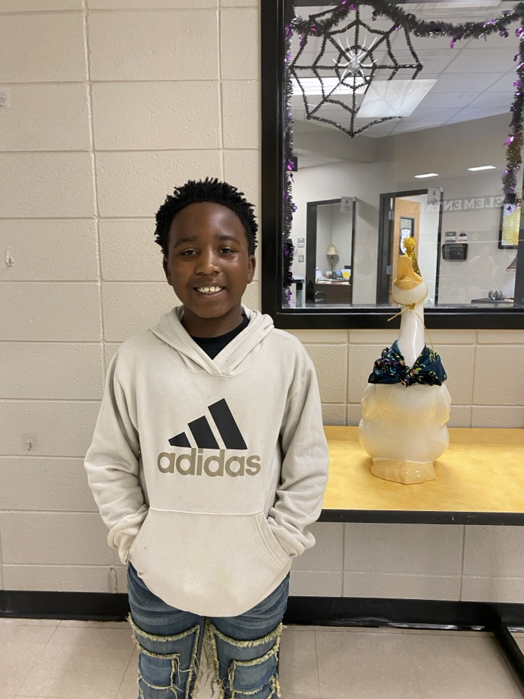  a student posing with the goose for his birthday pic