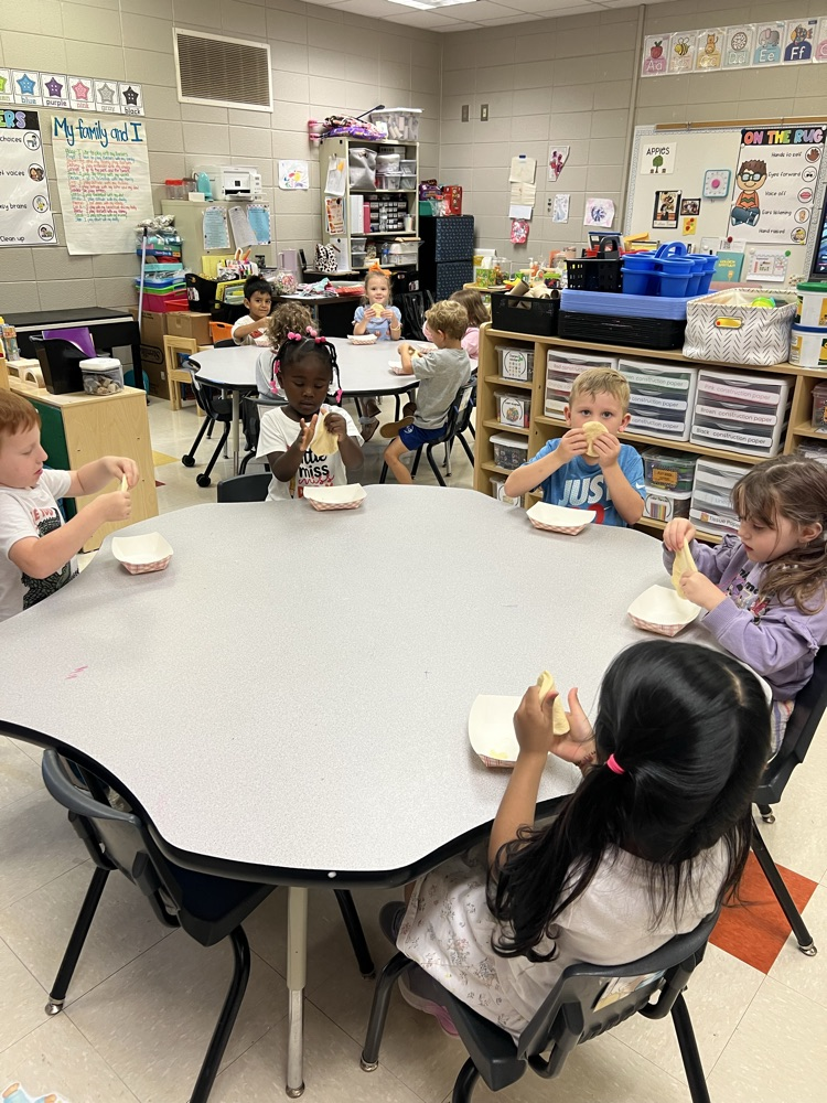 Pre-K students making apple pies with Mrs. Carver!