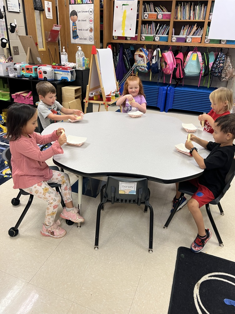 Pre-K students making apple pies with Mrs. Carver!