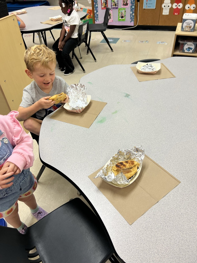 Pre-K students making apple pies with Mrs. Carver!