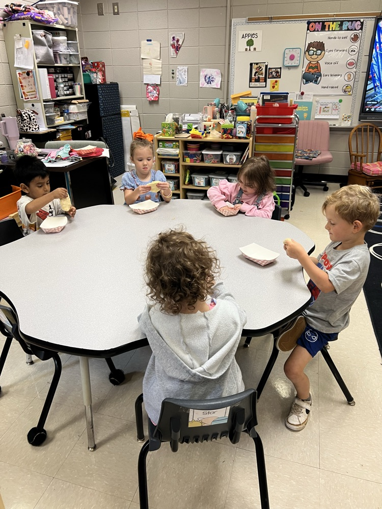 Pre-K students making apple pies with Mrs. Carver!