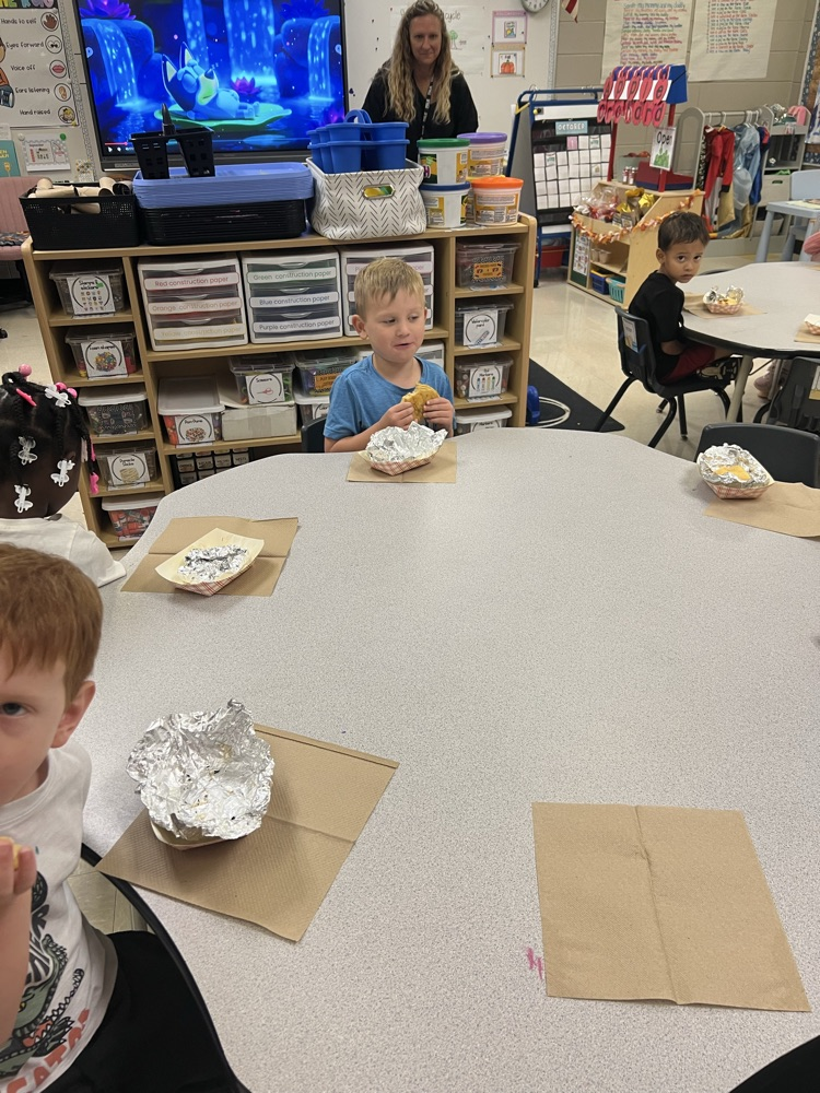 Pre-K students making apple pies with Mrs. Carver!